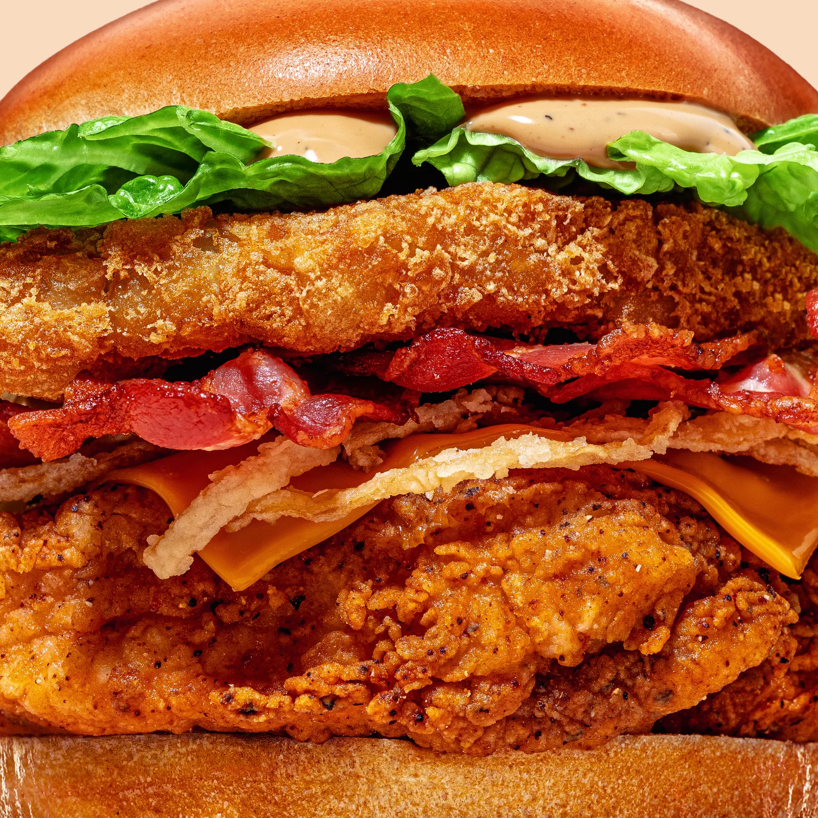 Close-up of a double chicken fillet burger with bacon, cheese and lettuce, Chickoo