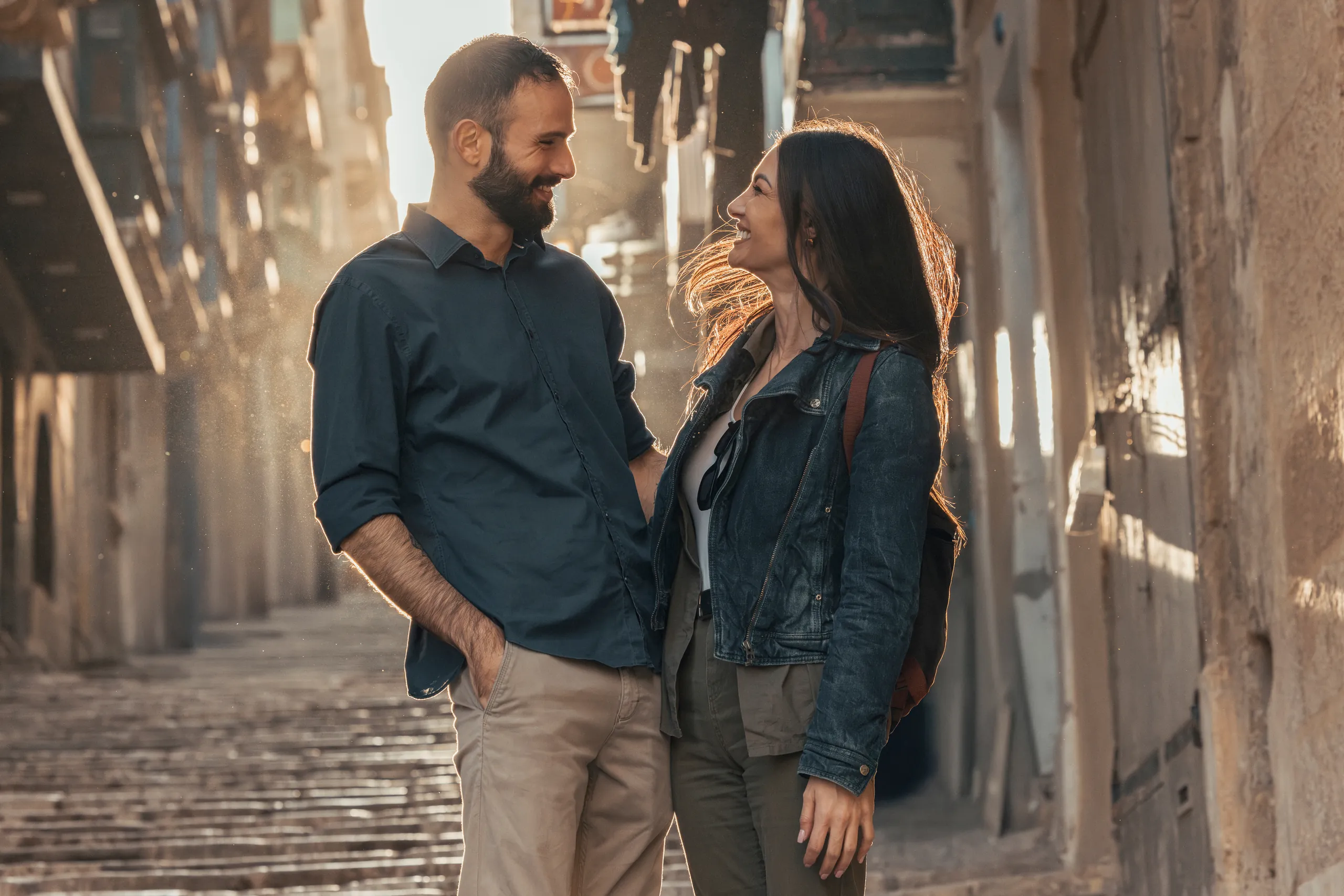 Couple talking in a narrow street in Valletta, Malta
