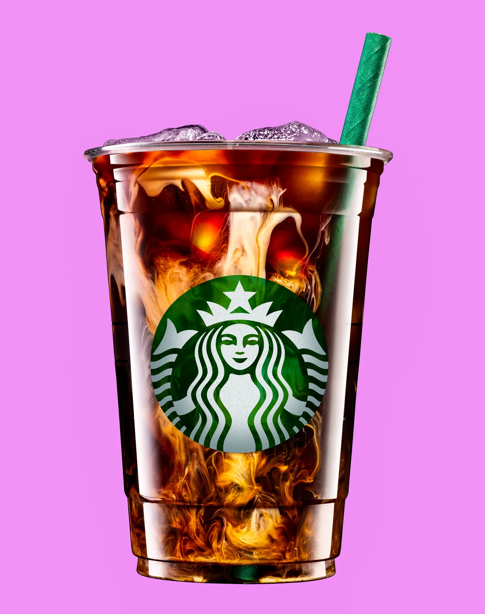 Iced coffee in a Starbucks cup on a pink background