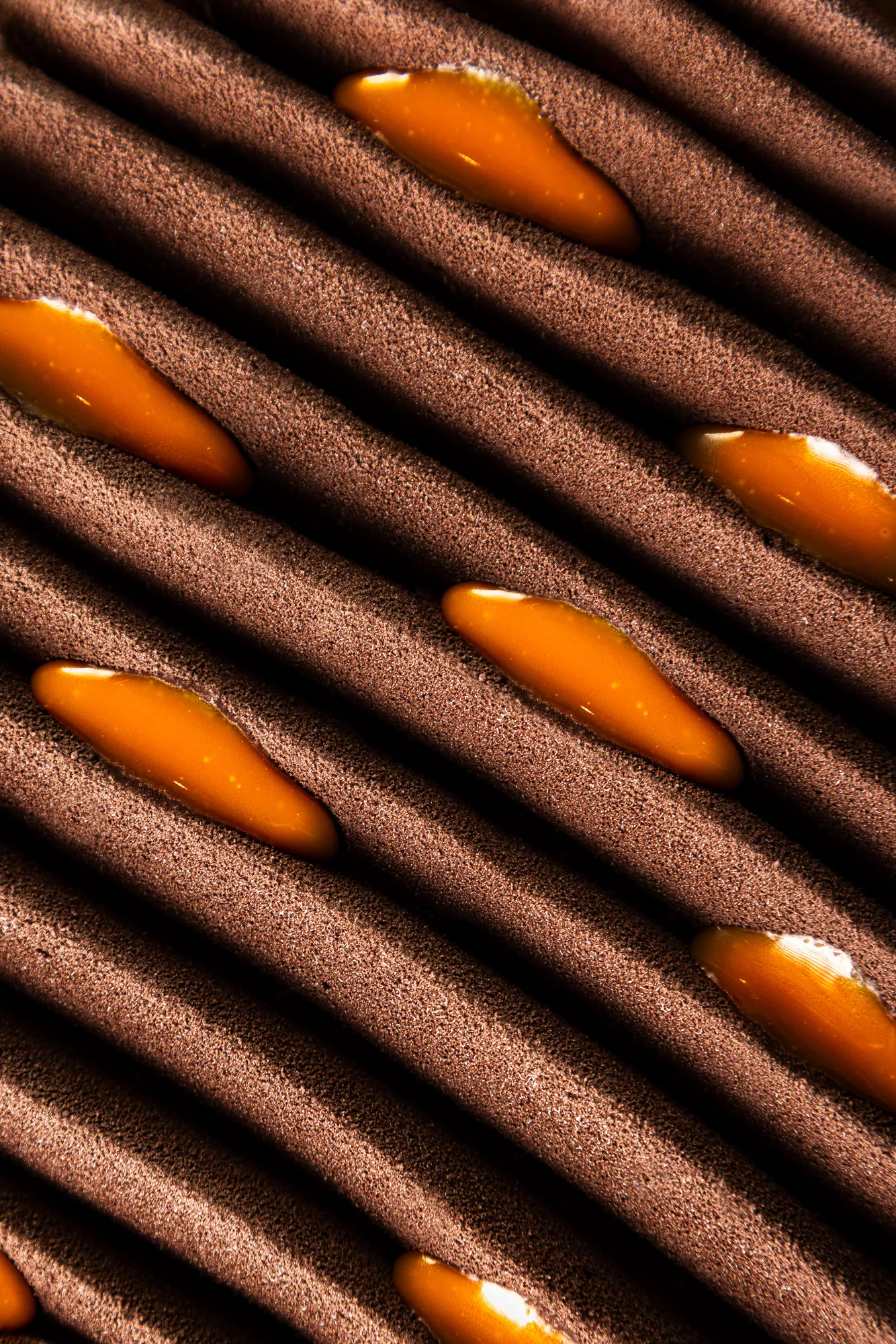 Chocolate wafers with orange filling in diagonal rows