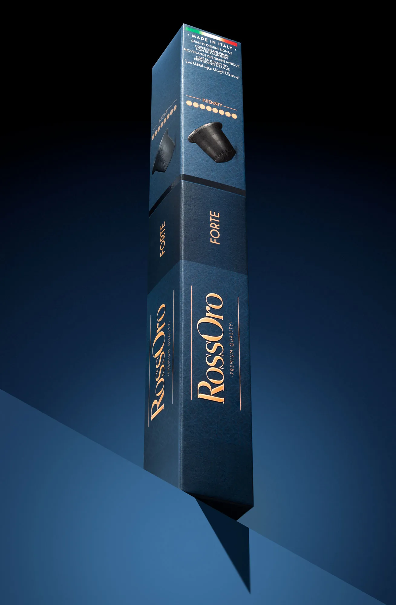 RossOro capsule box standing upright against a dark blue background